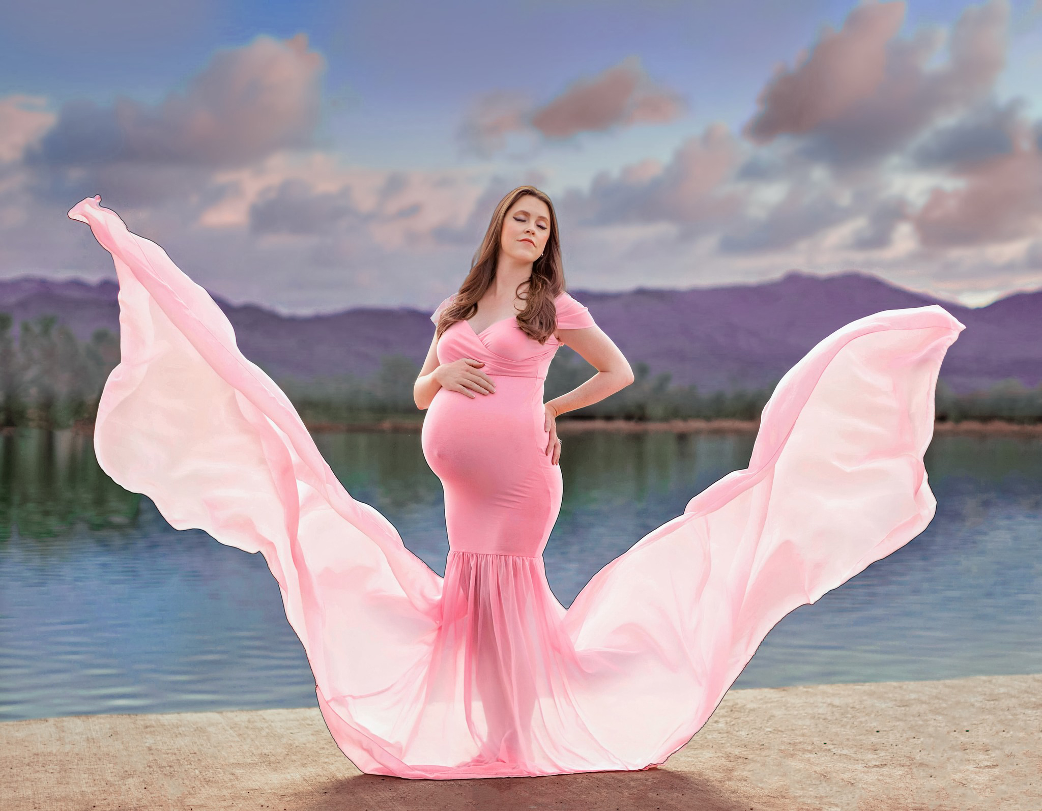 Pregnant mom in a gorgeous flowy maternity dress at Coot's Lake in Boulder, Colorado.