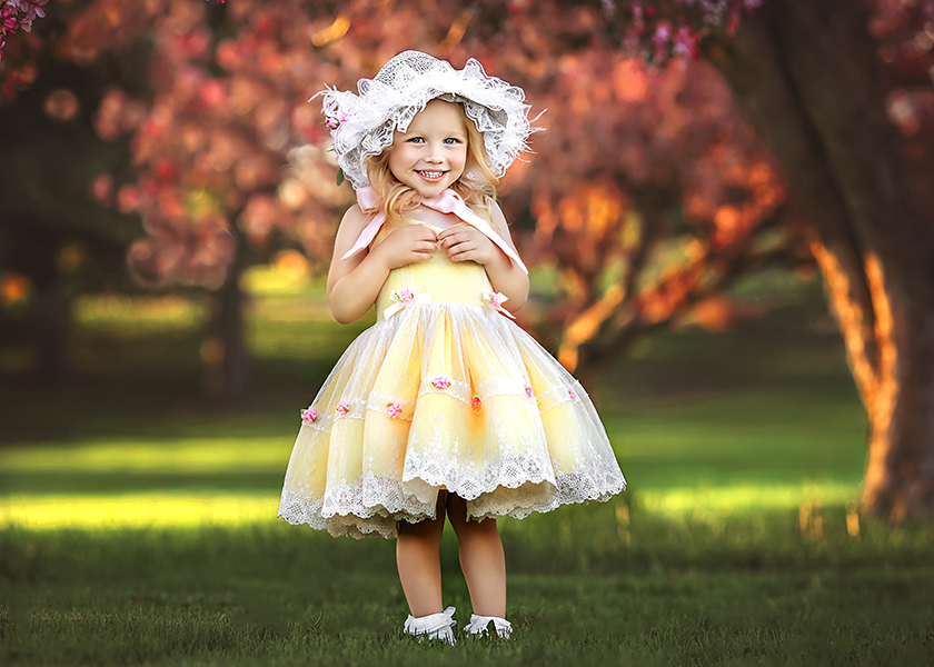 Child session in front of the pretty Cherry Blossom trees in Denver.