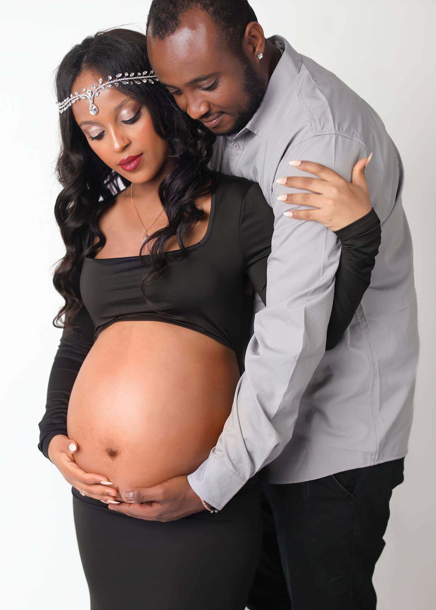 Beautiful celebrating their pregnancy at their Denver maternity photographer session.