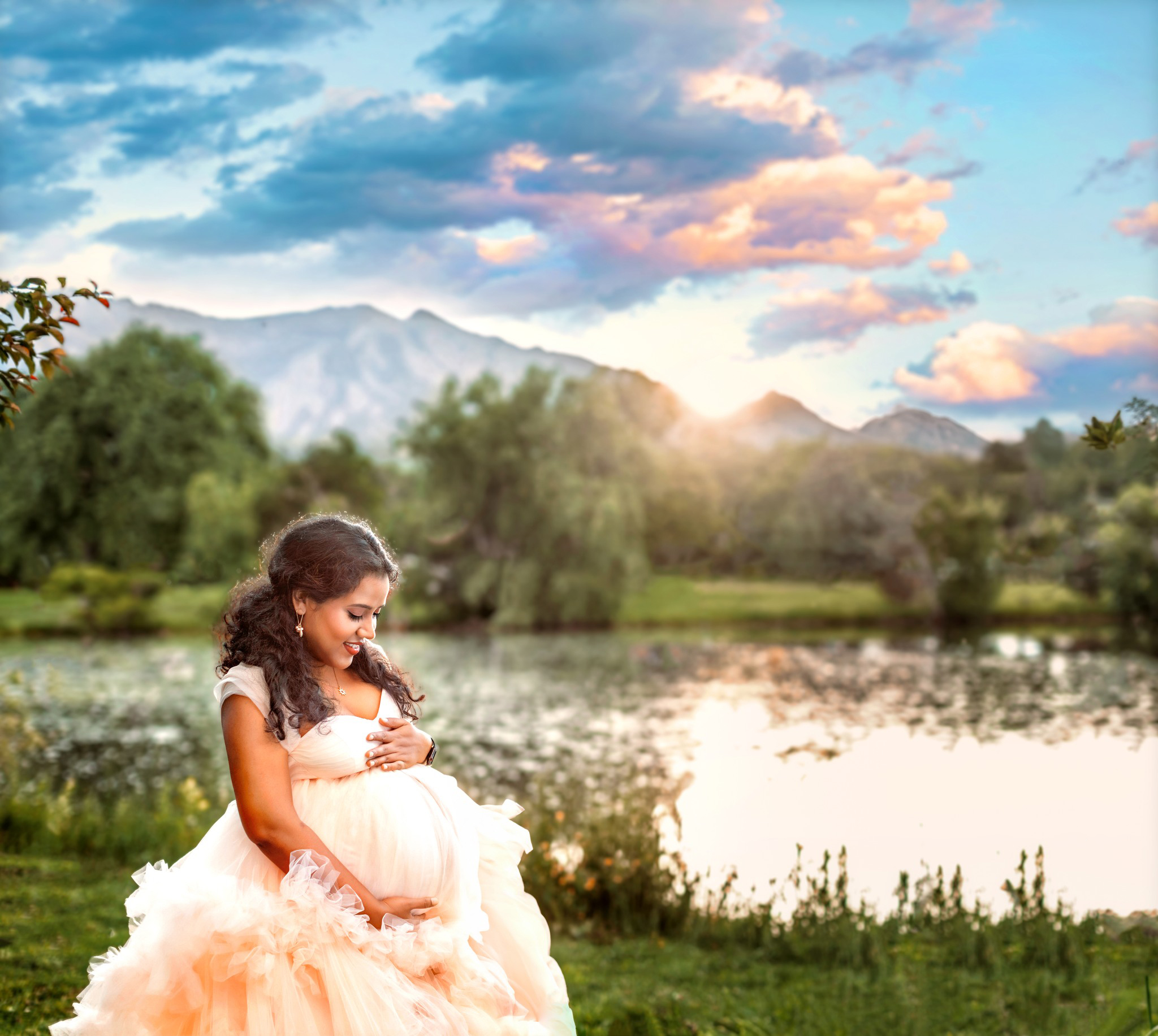 Beautiful momma to be posing in white maternity dress after her Denver yoga studios class.