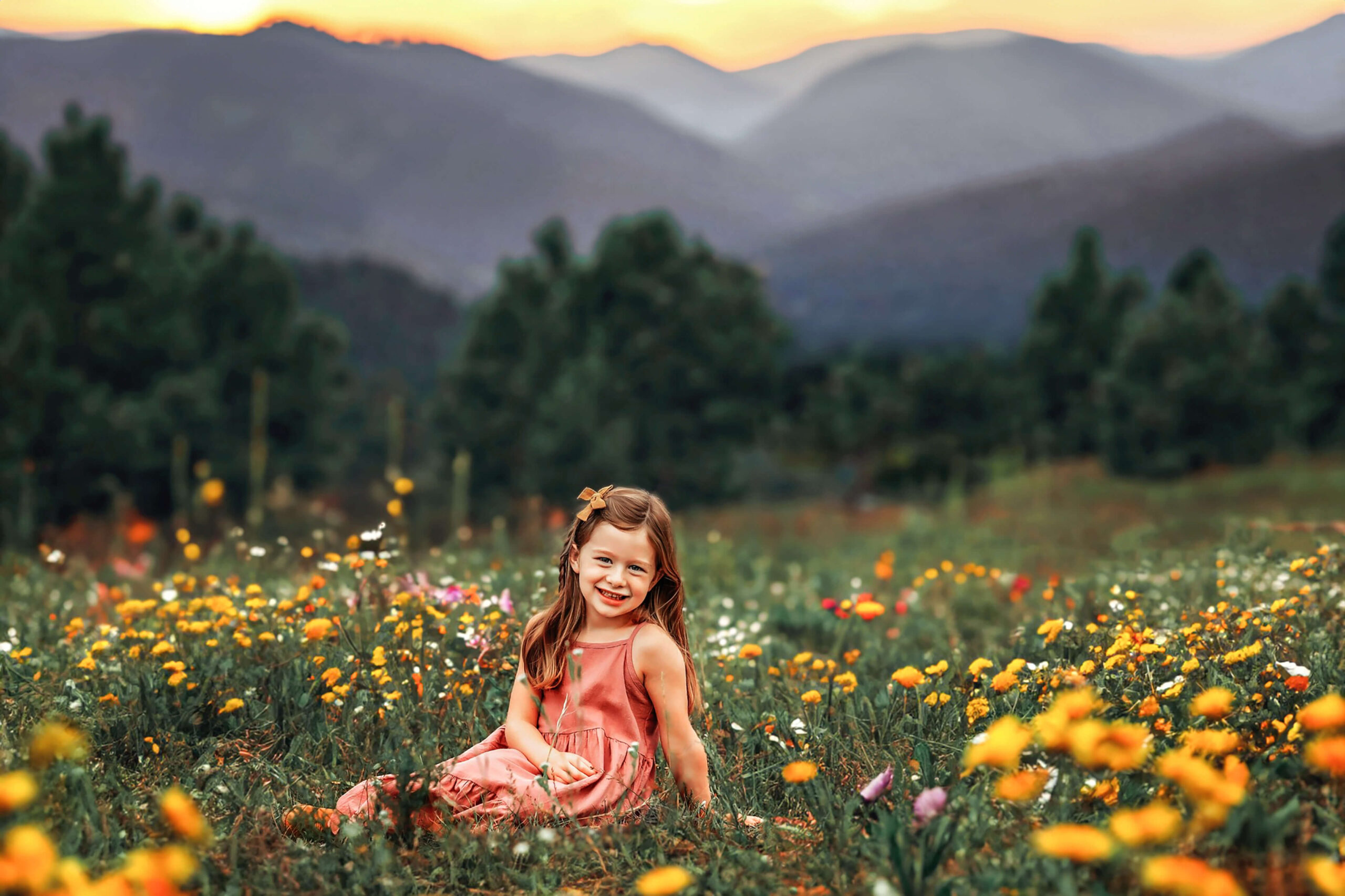 Young lady posing in peach colored dress amidst the yellow wild flowers at Mt. Falcon.